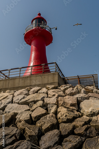 Red lighthouse on pier in Pyeongtaek, South Korea. photo