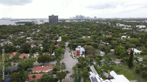 Very slow aerial of Miami suburbs with downtown Miami, Florida visible in the background photo