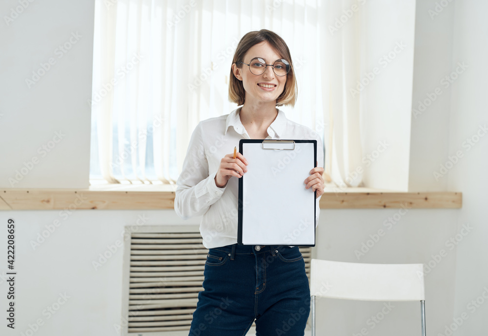 white sheet of paper Woman rooming near window interior Folder with documents white sheet of paper Woman rooming near window interior Folder with documents