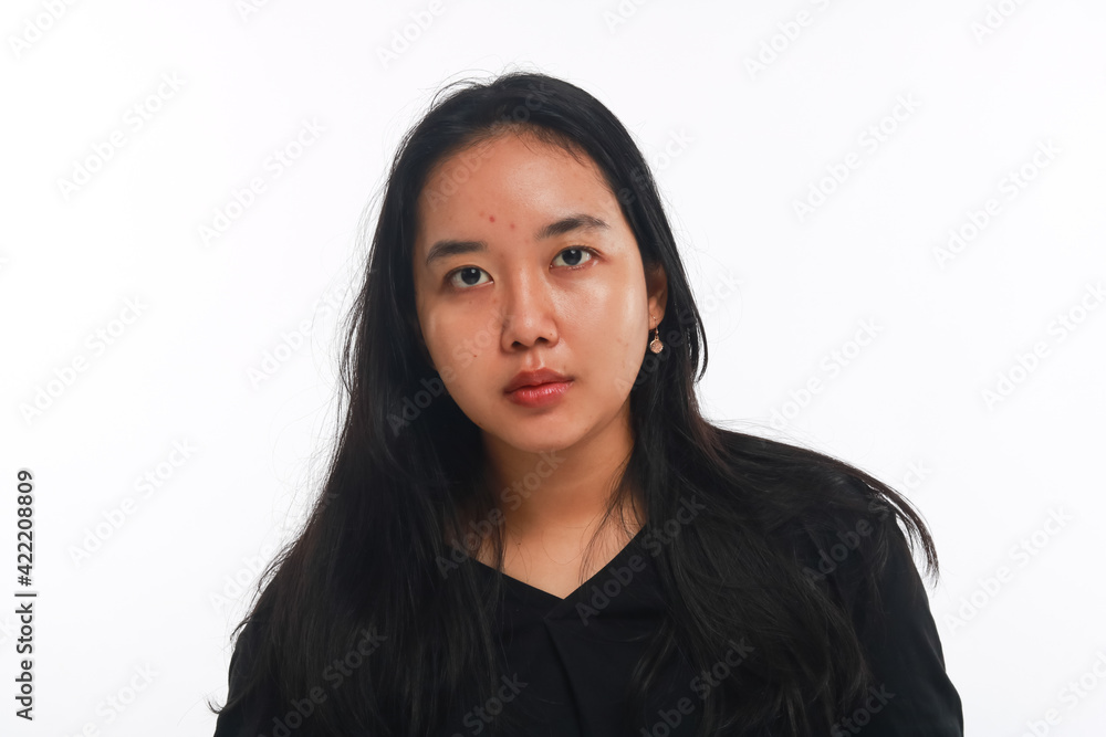 Young Asian woman with no make up on white background. Young Asian woman with no make up on white background.