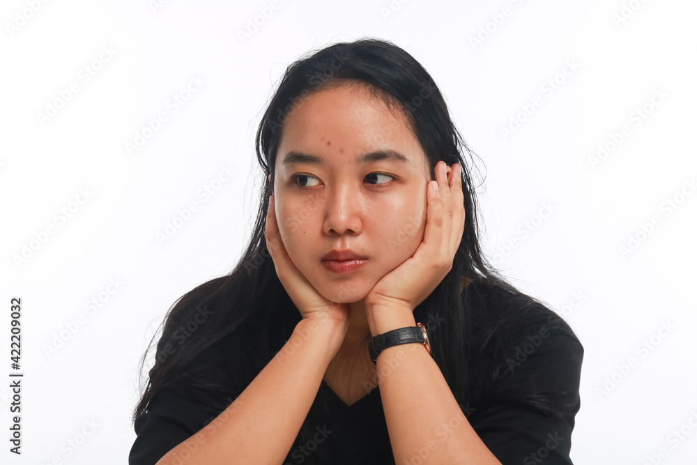 Young Asian woman with no make up on white background. Young Asian woman with no make up on white background.