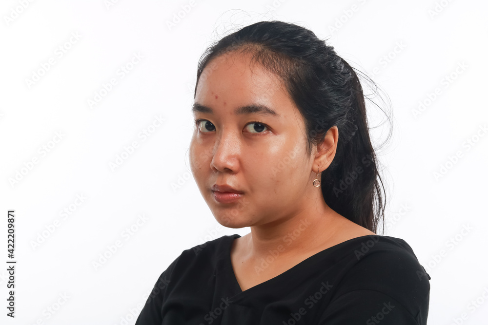 Young Asian woman with no make up on white background. Young Asian woman with no make up on white background.