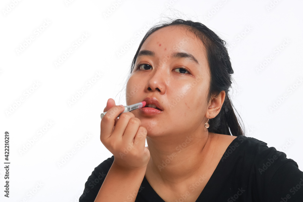 Beautiful woman holding cosmetic product. Beautiful woman holding cosmetic product.