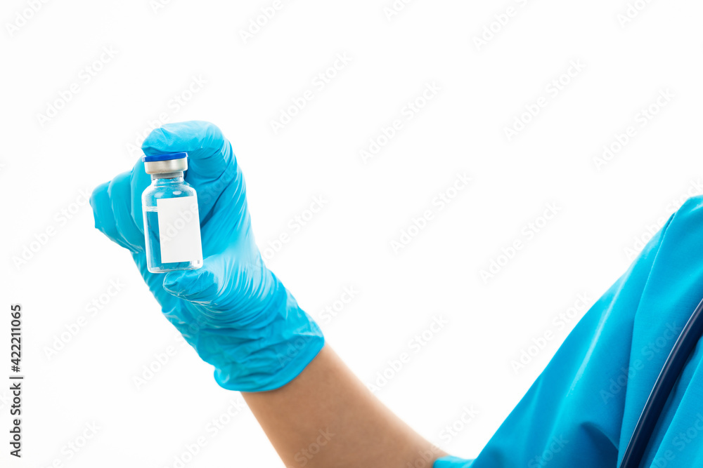 Obraz premium Female nurse with stethoscope puts on rubber gloves and wearing medical face mask, woman doctor in blue uniform holding COVID-19 vaccine, isolated on over white background, medical health concept