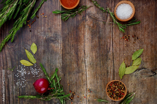 Aromatic dry herbs and spices on wooden table.