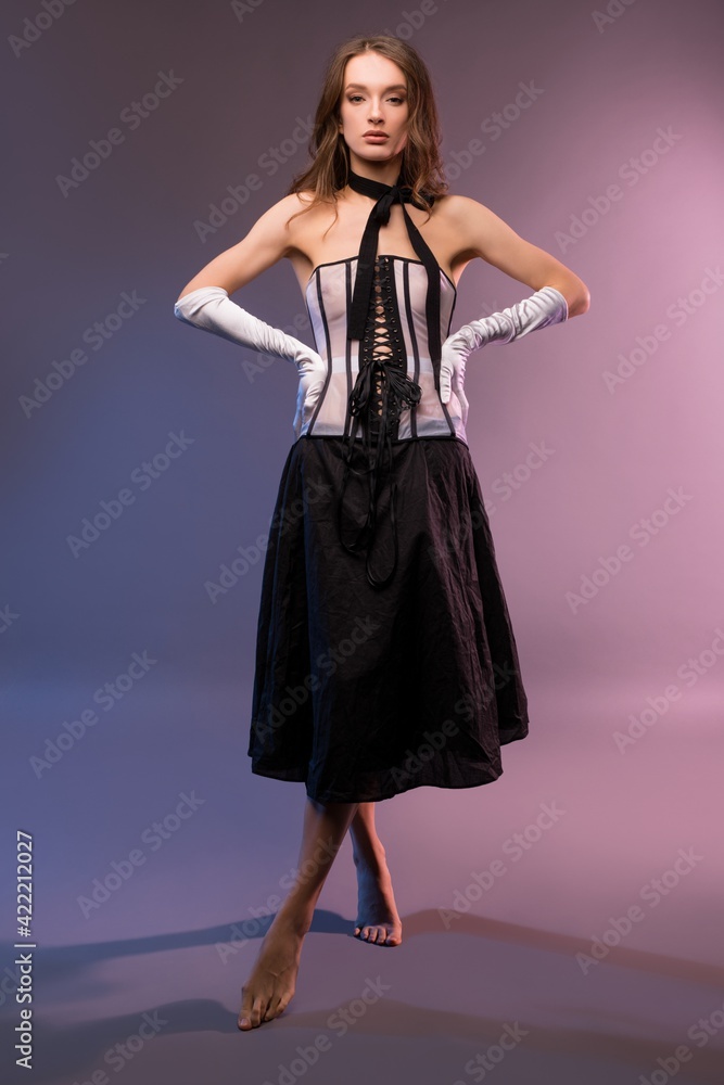 Fototapeta premium Female model in elegant clothes with corset
