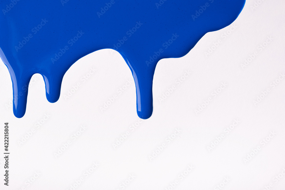 Navy blue liquid drops of paint color flow down on isolated white background. Abstract sapphire backdrop Navy blue liquid drops of paint color flow down on isolated white background. Abstract sapphire backdrop
