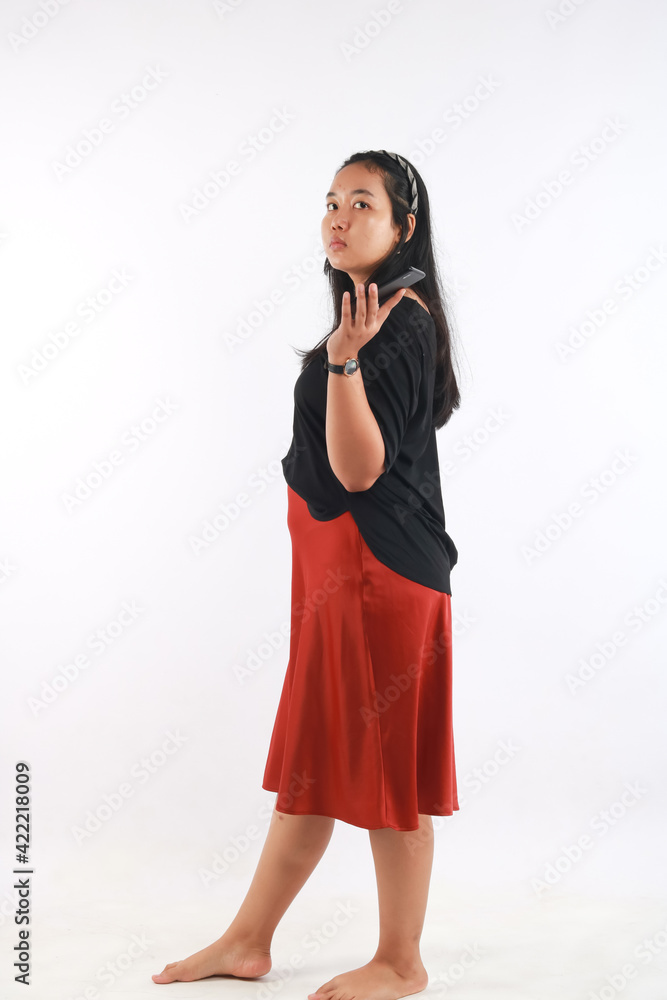 portrait of Asian Woman using smartphone on white background portrait of Asian Woman using smartphone on white background