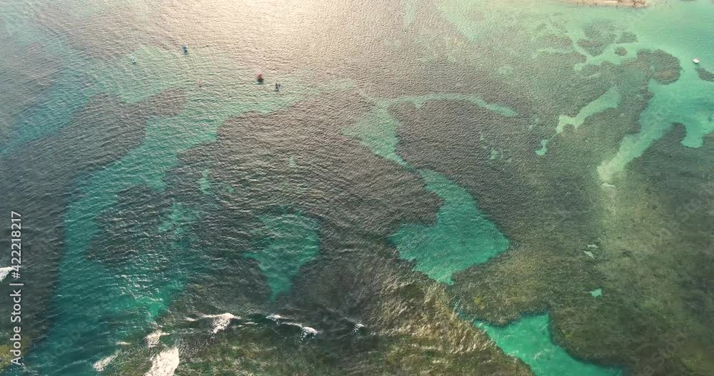 Breathtaking aerial birds eye view of the clear tropical waters on the coast of Porto de Galinhas. Breathtaking aerial birds eye view of the clear tropical waters on the coast of Porto de Galinhas.