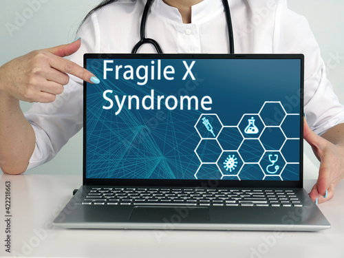 Select Fragile X Syndrome menu item. Doctor use cell technologies. photo