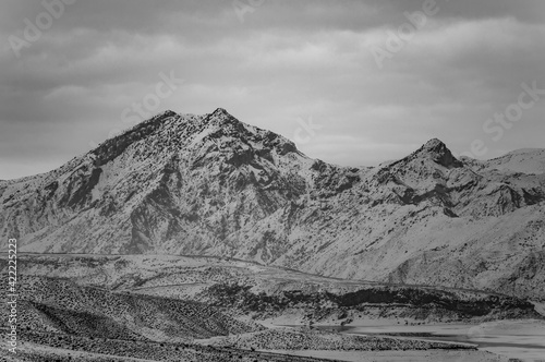 Black and white photo of Yeranos mountain range in Armenia on a snowy winter day