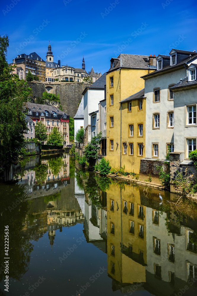 Luxembourg city, Luxembourg - July 16, 2019: Cozy riverside houses in Luxembourg city on a sunny summer day