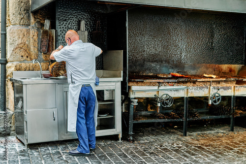 street chef prepares sea fish