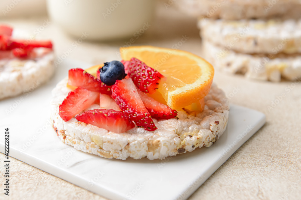 Board with rice cracker on grunge background Board with rice cracker on grunge background