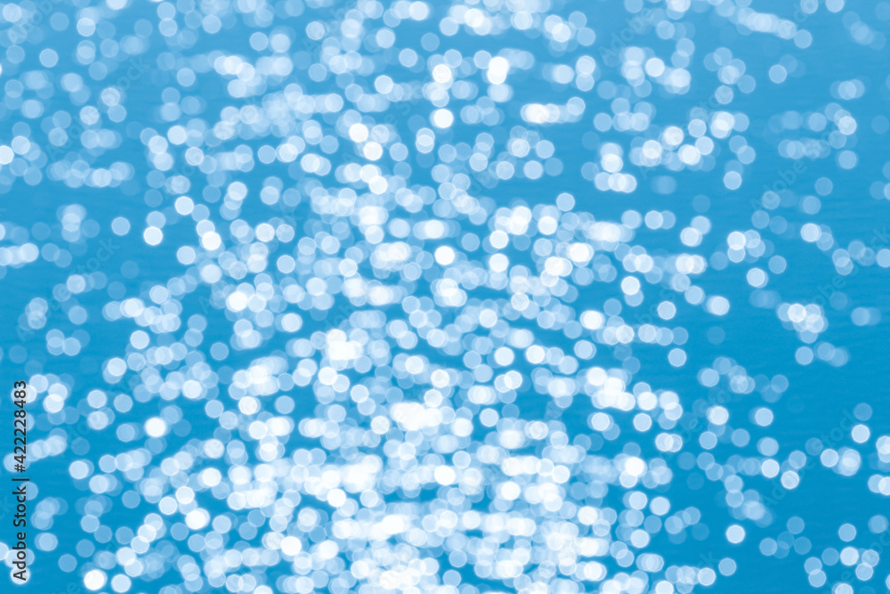 Blurred sparkle bokeh abstract colorful blue background Blurred sparkle bokeh abstract colorful blue background