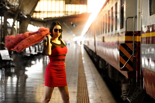 LGBT Transgender model travels on train at station railway