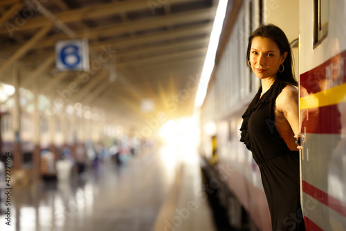 LGBT Transgender model travels on train at station railway