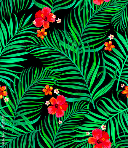Vector tropical seamless pattern with hibiscus flowers and palm leaves. © Logunova Elena