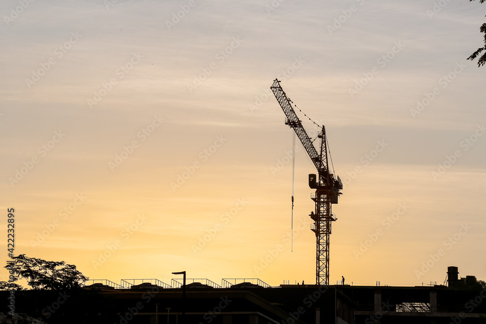 Beautiful sunset with silhouette effect of tower crane