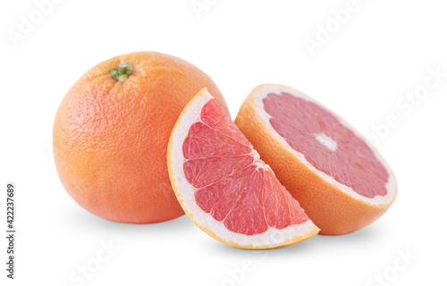 One whole grapefruit and two slices isolated on white background