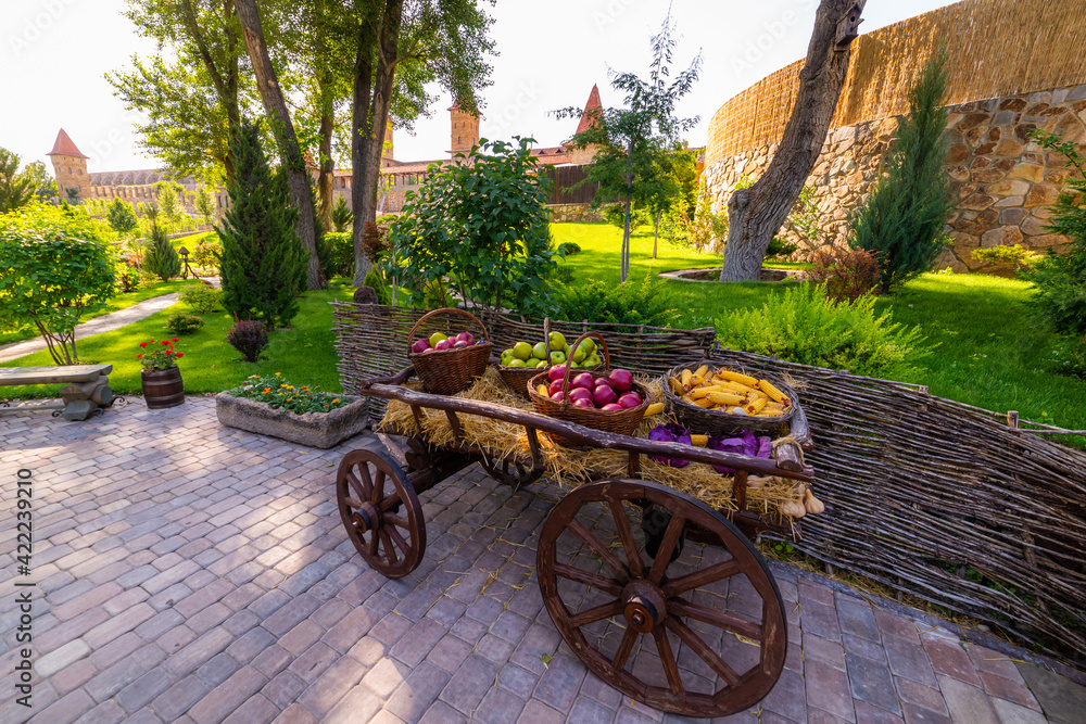Farm cart. There are baskets with fresh fruits and vegetables