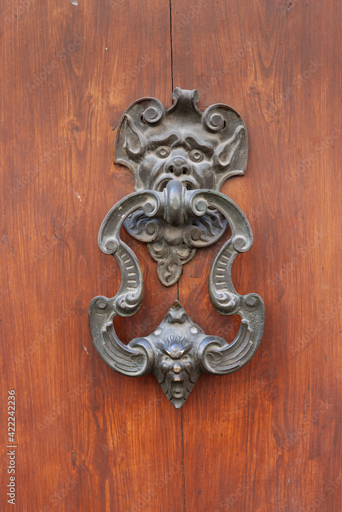 Medieval door handle, element of architectural decoration Medieval door handle, element of architectural decoration