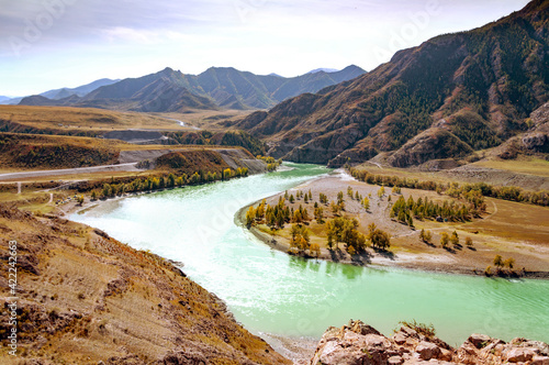 Scenic aerial view of confluence of Chuya and Katun rivers in the mountains. Altai autumn landscape, Russia