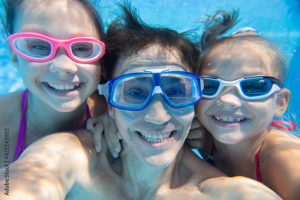 family  in swimming pool