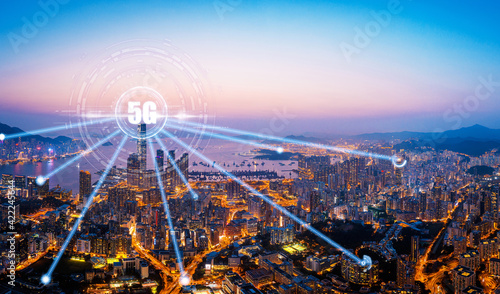 5G network digital hologram and internet of things on city background.5G network wireless systems.