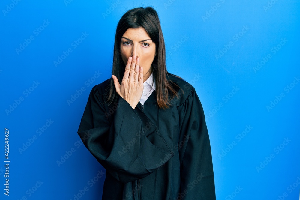 Young hispanic woman wearing judge uniform bored yawning tired covering mouth with hand. restless and sleepiness. Young hispanic woman wearing judge uniform bored yawning tired covering mouth with hand. restless and sleepiness.