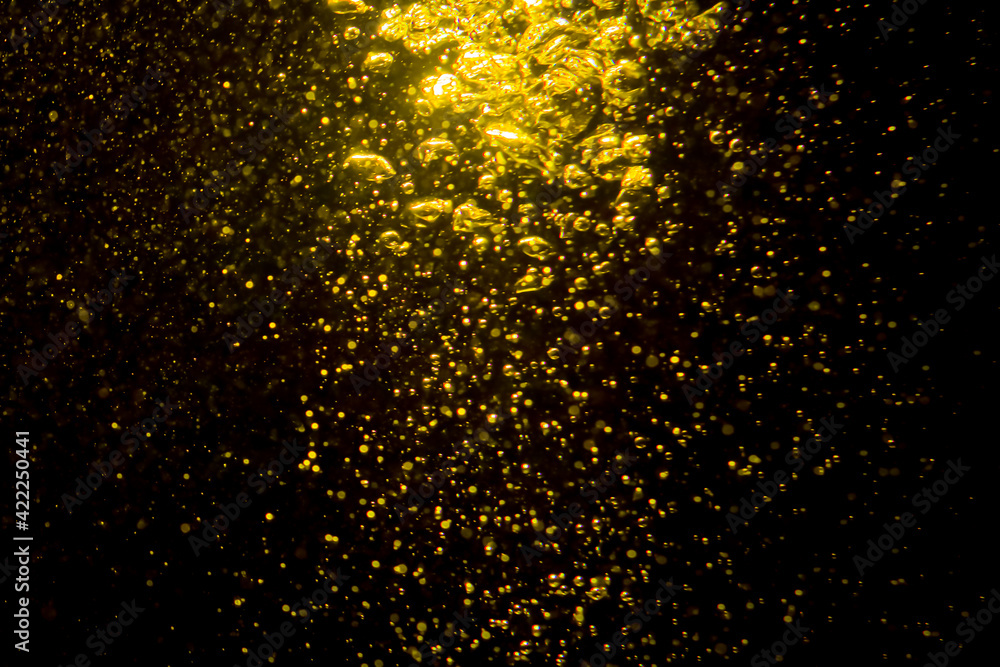 Gold bokeh of lights from water