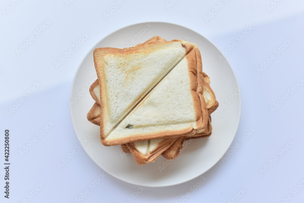 Toast on a white plate on a white background Toast on a white plate on a white background