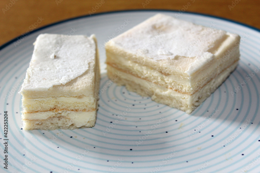 Snow White Cake (or Alba ca Zapada in Romanian language) traditional cake on a blue circled plate Snow White Cake (or Alba ca Zapada in Romanian language) traditional cake on a blue circled plate