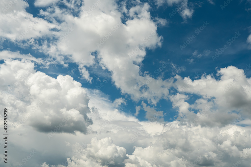 Obraz premium White clouds on a blue sky. Nature background.