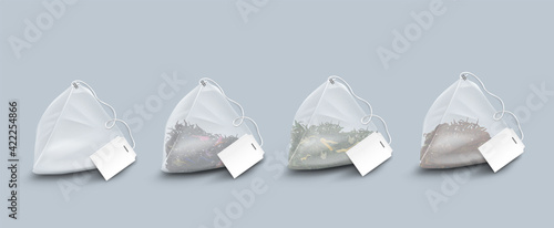 Pyramid shape tea bags with leaves and herbs