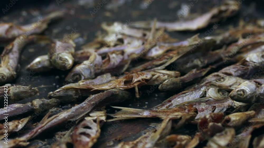 River fish baked and dried in the oven. Lies on a baking sheet. Close-up shot. River fish baked and dried in the oven. Lies on a baking sheet. Close-up shot.