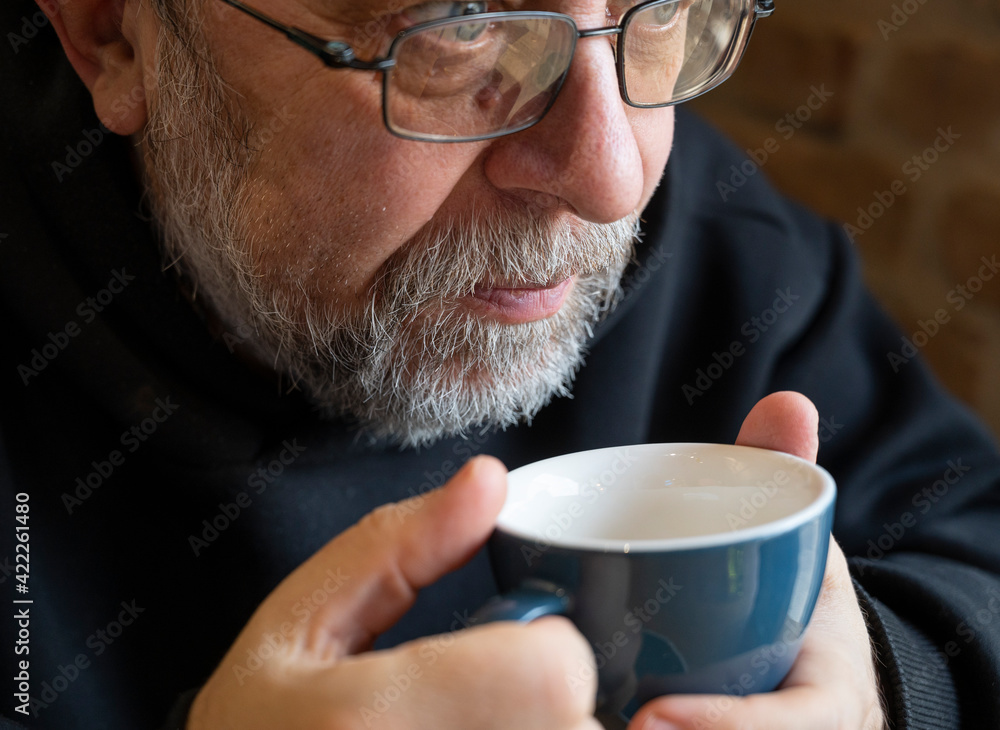 senior man enjoying cup of coffee in cafe senior man enjoying cup of coffee in cafe