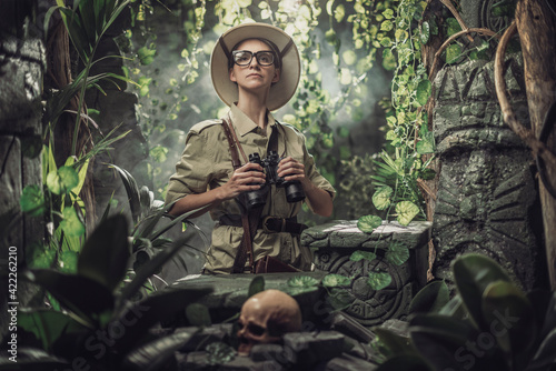 Brave woman exploring the tropical jungle photo