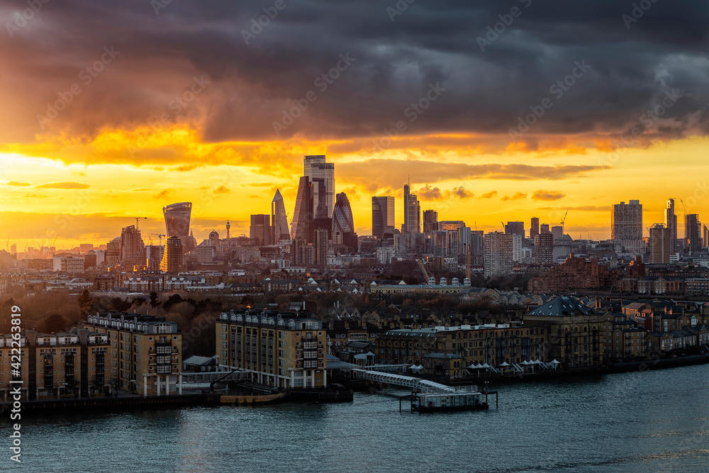 The skyline of the City of London, United Kingdom, during a colorful sunset