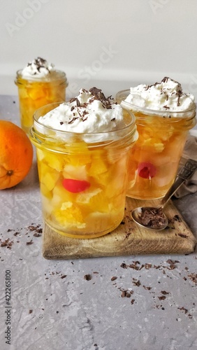 Sweet jelly and fruits dessert in jars
