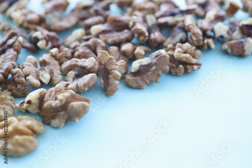 Walnuts on blue background. Benefits of nuts in daily human die