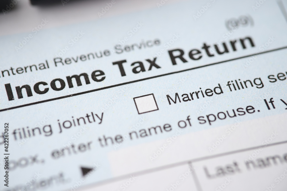 Document with the income tax form is on table Document with the income tax form is on table
