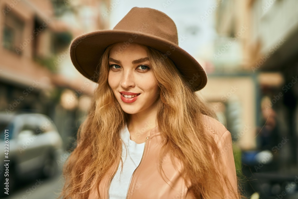 Young blonde girl smiling happy standing at the city. Young blonde girl smiling happy standing at the city.