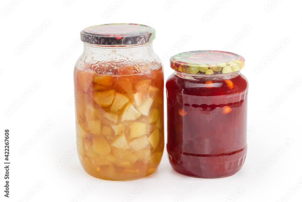 Apricot and apple jam in two different glass jars Apricot and apple jam in two different glass jars