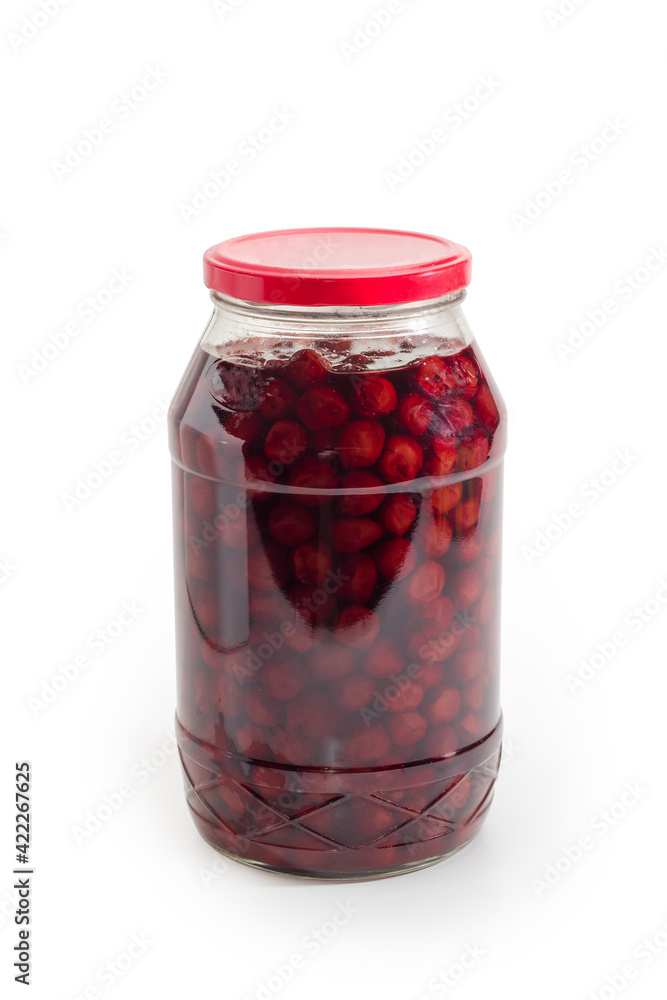 Cherry jam with whole berries in glass jar Cherry jam with whole berries in glass jar