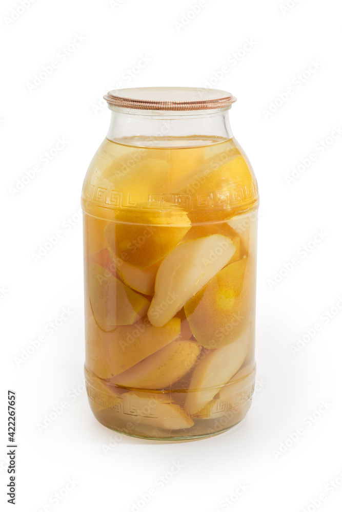 Canned pears in glass jar on a white background Canned pears in glass jar on a white background