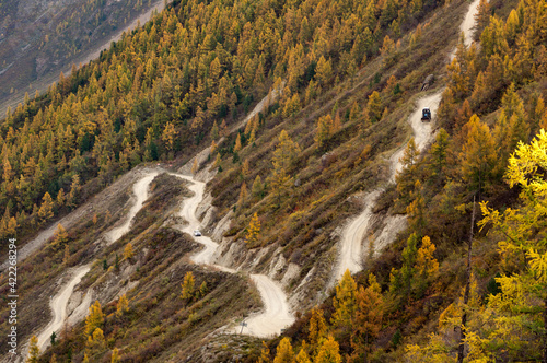 Scenic aerial view over Katu-Yaryk pass in the mountains (dangerous gravel road). Altai autumn landscape, Russia