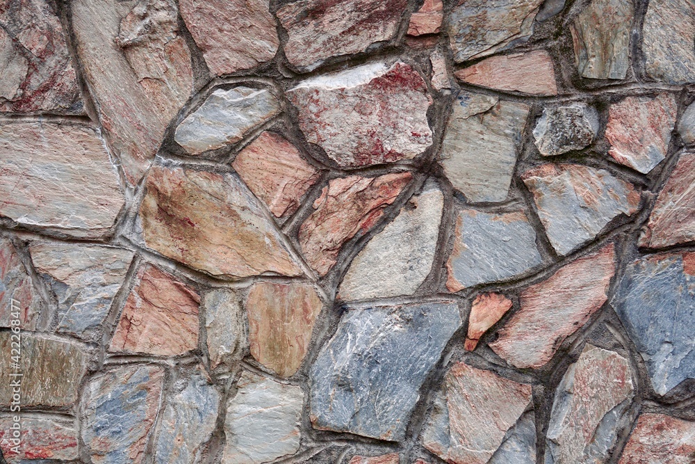 red stone building wall, textured abstract background red stone building wall, textured abstract background