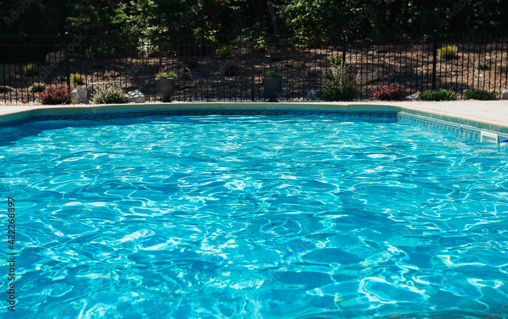 Blue water in the pool on a sunny summer day. Summer background