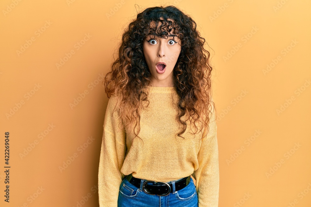 Young hispanic girl wearing casual clothes afraid and shocked with surprise expression, fear and excited face. Young hispanic girl wearing casual clothes afraid and shocked with surprise expression, fear and excited face.
